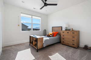 Bedroom featuring ceiling fan and light colored carpet