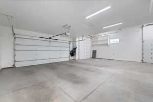 Garage featuring a garage door opener