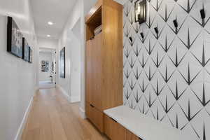 Hallway featuring light hardwood / wood-style flooring