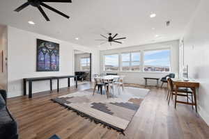 Dining area featuring ceiling fan and light hardwood / wood-style flooring