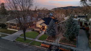 Aerial view at dusk featuring a mountain view