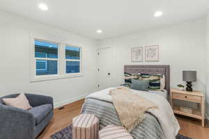 Bedroom featuring wood-type flooring