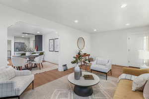 Living room with light wood-type flooring