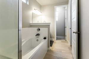 Bathroom with a tub to relax in