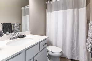 Bathroom with vanity and toilet