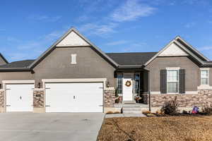 View of front facade featuring a garage