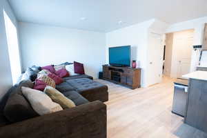 Living room with light hardwood / wood-style flooring