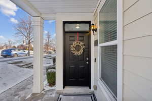 View of snow covered property entrance