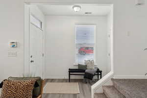 Entryway featuring hardwood / wood-style flooring