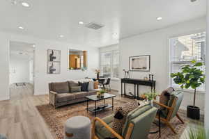 Living room with light wood-type flooring