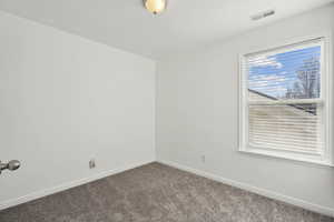 View of carpeted spare room