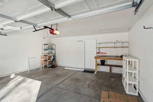 Garage featuring a garage door opener