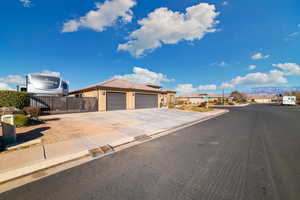 View of front of home featuring a mountain view and a garage