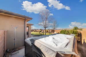 Exterior space with a hot tub