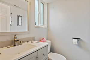 Bathroom with vanity and toilet