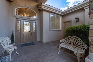 Property entrance with a patio