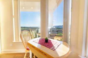 Dining space featuring a mountain view and hardwood / wood-style flooring