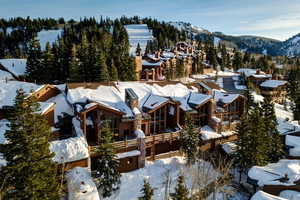 Snowy aerial view featuring a mountain view