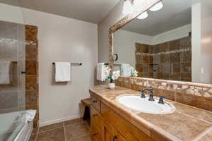 Bathroom featuring tile patterned floors and vanity