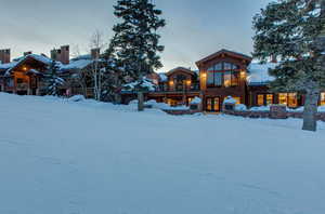 View of snow covered rear of property