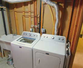 Laundry room featuring sink and washer and dryer