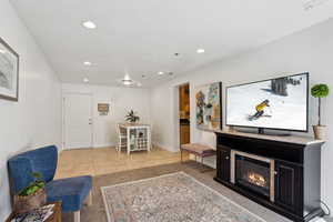 Living room with light tile patterned floors