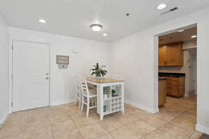 Dining room featuring light tile patterned floors