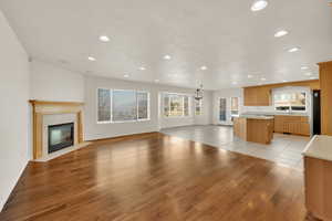 Unfurnished living room with a fireplace and light hardwood / wood-style flooring