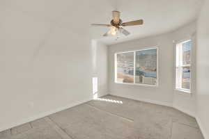 Spare room with carpet floors and ceiling fan