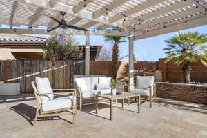 View of patio / terrace featuring an outdoor living space, ceiling fan, and a pergola