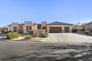 View of front facade featuring a garage