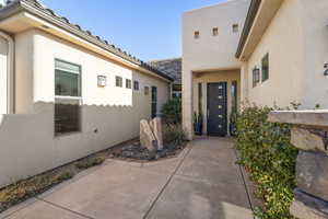 Property entrance featuring a patio area