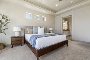 Bedroom featuring carpet floors and ensuite bath