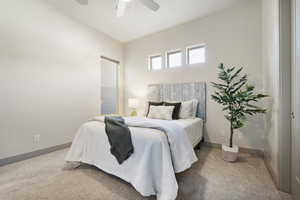 Bedroom featuring ceiling fan and carpet flooring