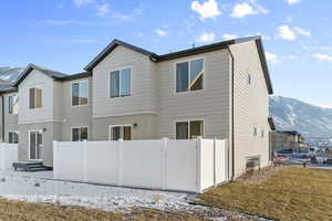 Rear view of house featuring a mountain view