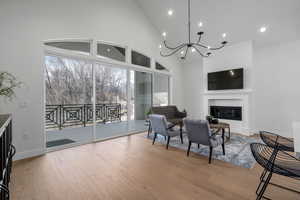 Living room and dining area with creek views from large covered patio