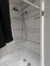 Bathroom featuring tiled shower