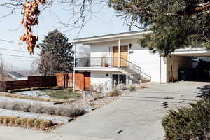 View of front of property with a carport