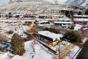 Snowy aerial view featuring a mountain view