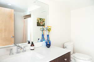 Bathroom with vanity and toilet