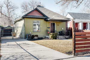 Bungalow-style house with cooling unit