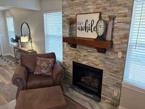 Living room with hardwood / wood-style floors and a fireplace