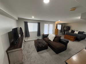 Living room featuring a wealth of natural light and carpet floors