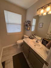 Bathroom with vanity and toilet