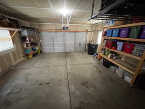 Garage featuring a garage door opener