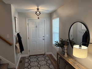 Foyer featuring dark wood-type flooring