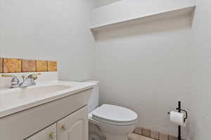 Bathroom with vanity and toilet