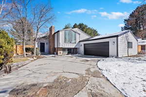 View of front of property featuring a garage