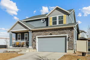 Craftsman house featuring a garage