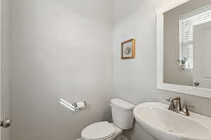 Bathroom featuring sink and toilet